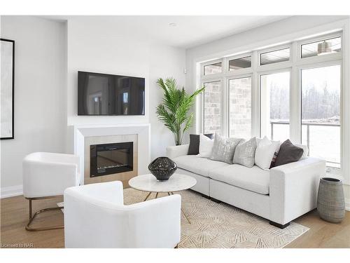 70C-586 Seneca Drive, Fort Erie, ON - Indoor Photo Showing Living Room With Fireplace