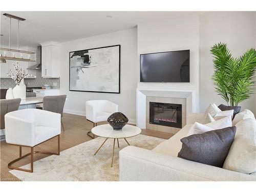 70C-586 Seneca Drive, Fort Erie, ON - Indoor Photo Showing Living Room With Fireplace