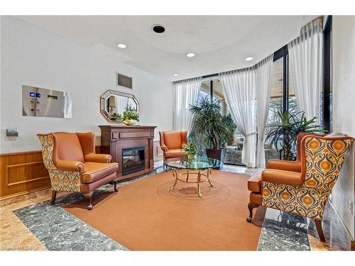 506-3 Towering Heights Boulevard, St. Catharines, ON - Indoor Photo Showing Living Room With Fireplace