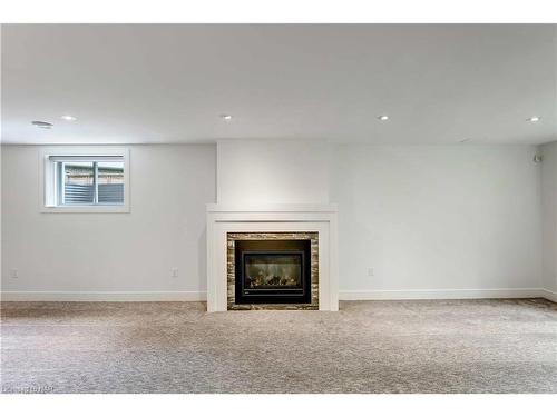 5-7276 Optimist Lane Lane, Niagara Falls, ON - Indoor Photo Showing Other Room With Fireplace