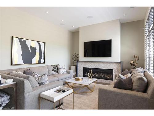 8-2 Black Walnut Common, St. Catharines, ON - Indoor Photo Showing Living Room With Fireplace