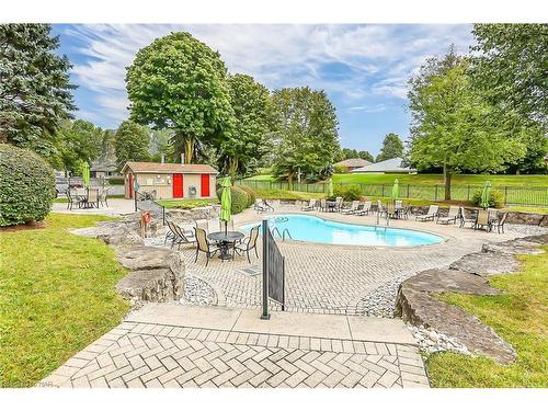 710-5100 Dorchester Road, Niagara Falls, ON - Outdoor With In Ground Pool With Backyard