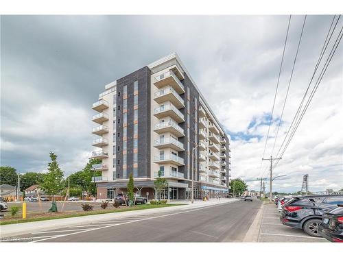 203-118 West Street, Port Colborne, ON - Outdoor With Balcony With Facade