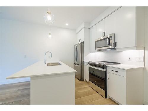 203-118 West Street, Port Colborne, ON - Indoor Photo Showing Kitchen With Stainless Steel Kitchen With Double Sink With Upgraded Kitchen