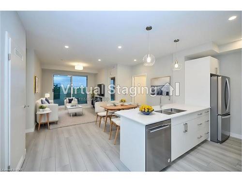 704-118 West Street, Port Colborne, ON - Indoor Photo Showing Kitchen With Stainless Steel Kitchen With Double Sink With Upgraded Kitchen