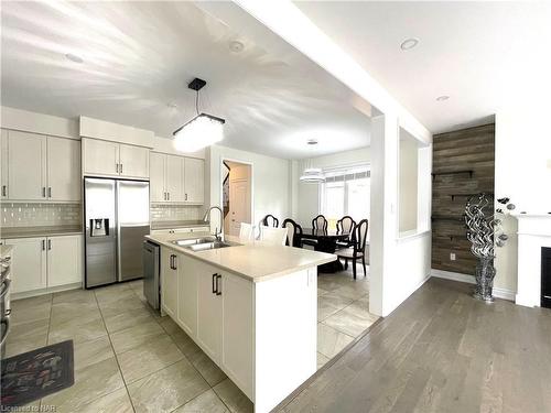 7729 Hackberry Trail, Niagara Falls, ON - Indoor Photo Showing Kitchen With Fireplace With Double Sink