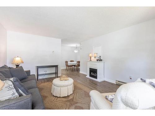 110-2 Walnut Street, St. Catharines, ON - Indoor Photo Showing Living Room With Fireplace