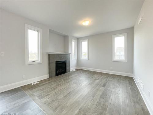 7709 Secretariat Court, Niagara Falls, ON - Indoor Photo Showing Living Room With Fireplace