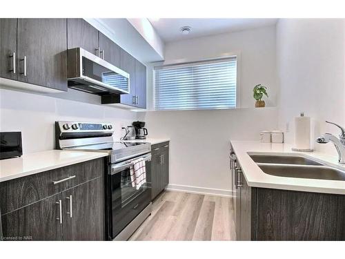 211-781 Clare Avenue, Welland, ON - Indoor Photo Showing Kitchen With Double Sink