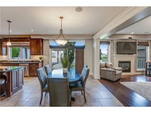 7178 St Michael Avenue, Niagara Falls, ON - Indoor Photo Showing Dining Room With Fireplace