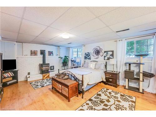 3195 St. Patrick Avenue, Niagara Falls, ON - Indoor Photo Showing Bedroom With Fireplace