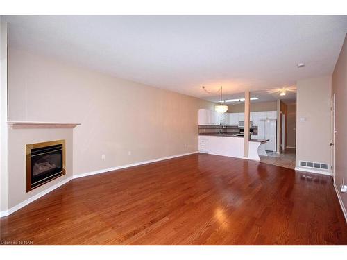 18-5070 Drummond Road, Niagara Falls, ON - Indoor Photo Showing Other Room With Fireplace