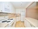 113-4658 Drummond Road, Niagara Falls, ON  - Indoor Photo Showing Kitchen With Double Sink 