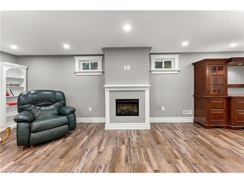 7949 Grossi Court, Niagara Falls, ON - Indoor Photo Showing Basement With Fireplace