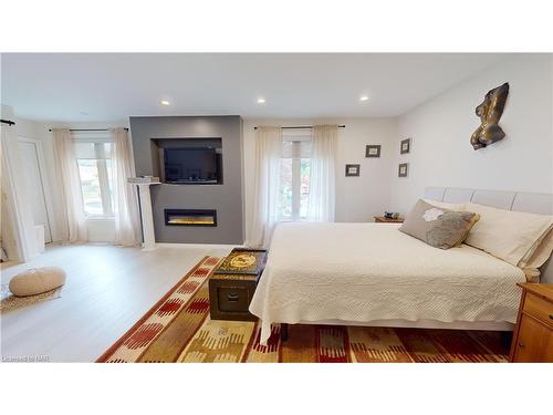 84 Ziraldo Road, St. Catharines, ON - Indoor Photo Showing Bedroom With Fireplace