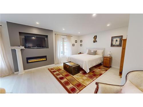 84 Ziraldo Road, St. Catharines, ON - Indoor Photo Showing Bedroom With Fireplace