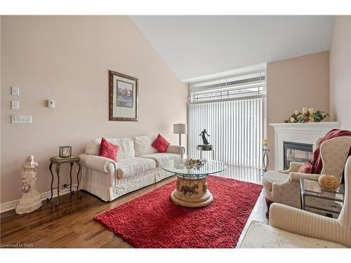 Ten-4300 Kalar Road, Niagara Falls, ON - Indoor Photo Showing Living Room With Fireplace