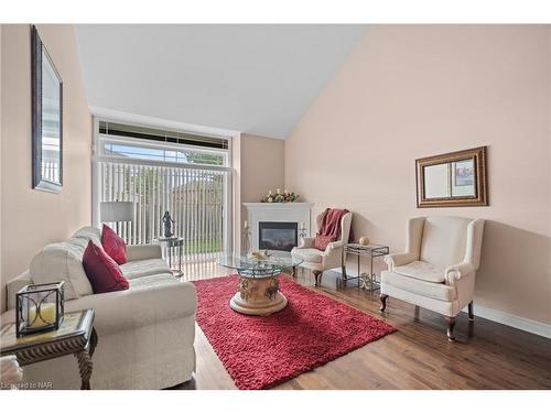 Ten-4300 Kalar Road, Niagara Falls, ON - Indoor Photo Showing Living Room With Fireplace