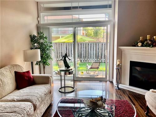 Ten-4300 Kalar Road, Niagara Falls, ON - Indoor Photo Showing Living Room With Fireplace