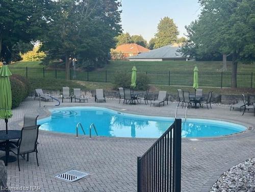 504-5100 Dorchester Road, Niagara Falls, ON - Outdoor With In Ground Pool With Backyard