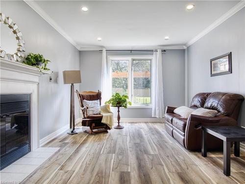 20 Chessington Street, St. Catharines, ON - Indoor Photo Showing Living Room With Fireplace