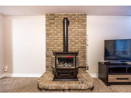 8 Donalda Court, St. Catharines, ON - Indoor Photo Showing Living Room With Fireplace