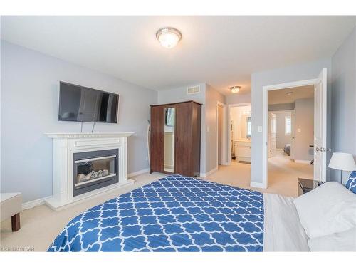 6254 Ash Street, Niagara Falls, ON - Indoor Photo Showing Bedroom With Fireplace