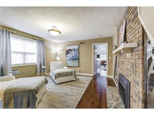 29 Colonel Butler Crescent, Niagara-On-The-Lake, ON - Indoor Photo Showing Bedroom With Fireplace