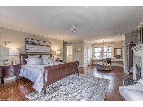 8 Hillcrest Avenue, St. Catharines, ON - Indoor Photo Showing Bedroom With Fireplace