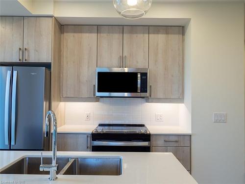 705-118 West Street, Port Colborne, ON - Indoor Photo Showing Kitchen With Stainless Steel Kitchen With Double Sink