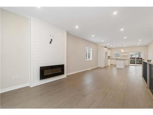 735 Dominion Road, Fort Erie, ON - Indoor Photo Showing Living Room With Fireplace