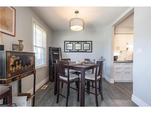 7992 Post Road, Niagara Falls, ON - Indoor Photo Showing Dining Room With Fireplace