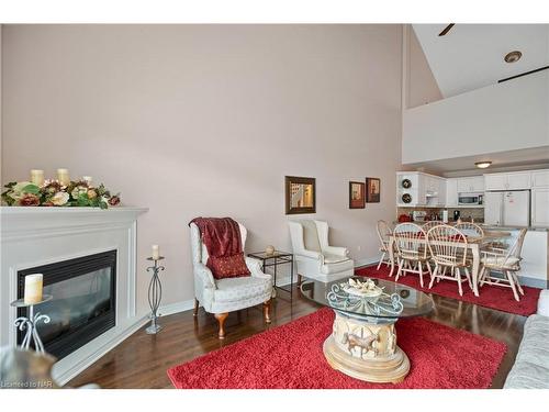 Ten-10-4300 Kalar Road, Niagara Falls, ON - Indoor Photo Showing Living Room With Fireplace