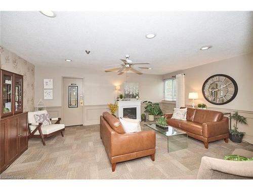 201-196 Scott Street, St. Catharines, ON - Indoor Photo Showing Living Room With Fireplace