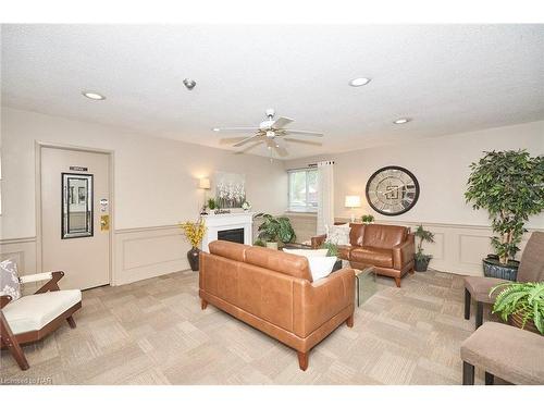 201-196 Scott Street, St. Catharines, ON - Indoor Photo Showing Living Room With Fireplace