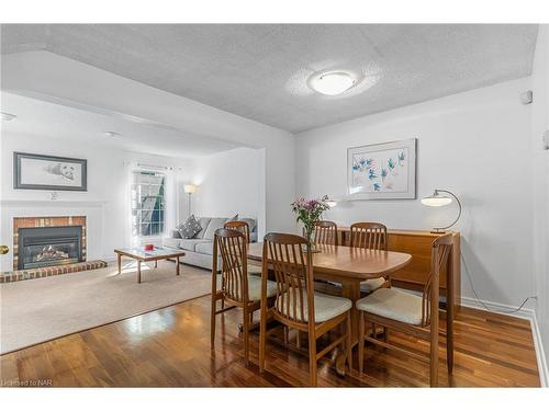 1-5 Carn Castle Gate, St. Catharines, ON - Indoor Photo Showing Dining Room With Fireplace