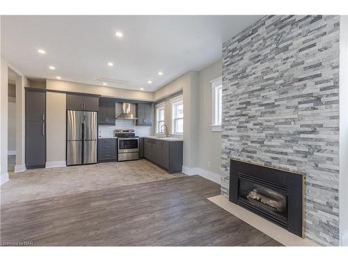 Main-238 West Main Street, Welland, ON - Indoor Photo Showing Other Room With Fireplace