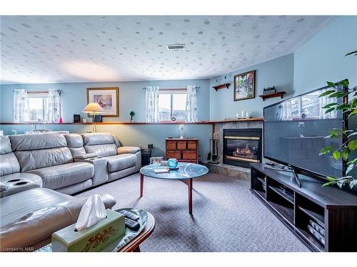 19 Windle Village Crescent, Thorold, ON - Indoor Photo Showing Living Room With Fireplace