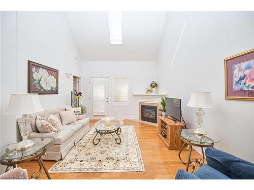 10-8142 Costabile Drive, Niagara Falls, ON - Indoor Photo Showing Living Room With Fireplace