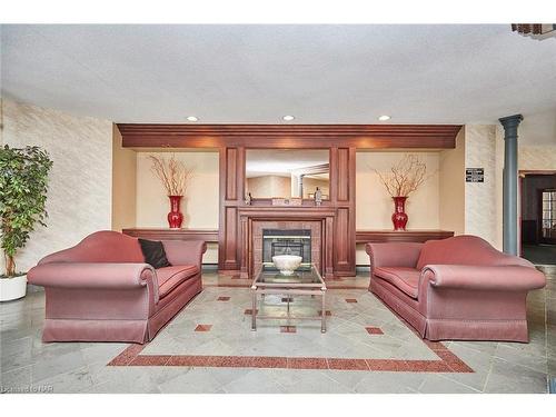 427-8111 Forest Glen Drive, Niagara Falls, ON - Indoor Photo Showing Living Room With Fireplace