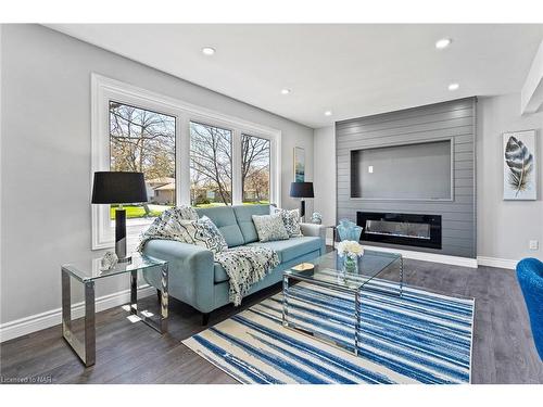 Upper-8235 Paddock Trail Drive, Niagara Falls, ON - Indoor Photo Showing Living Room With Fireplace