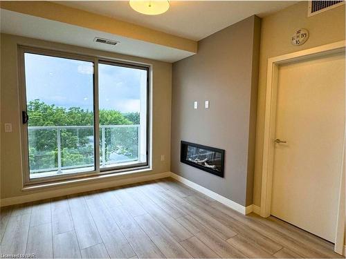 704-118 West Street, Port Colborne, ON - Indoor Photo Showing Other Room With Fireplace