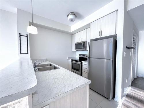 403-10 Concord Place, Grimsby, ON - Indoor Photo Showing Kitchen With Stainless Steel Kitchen With Double Sink