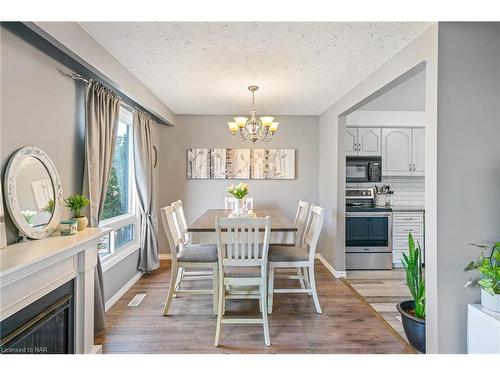 8 Argyle Court, Welland, ON - Indoor Photo Showing Dining Room With Fireplace