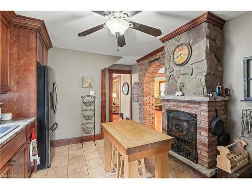 1 Welland Street N, Thorold, ON - Indoor Photo Showing Kitchen With Fireplace