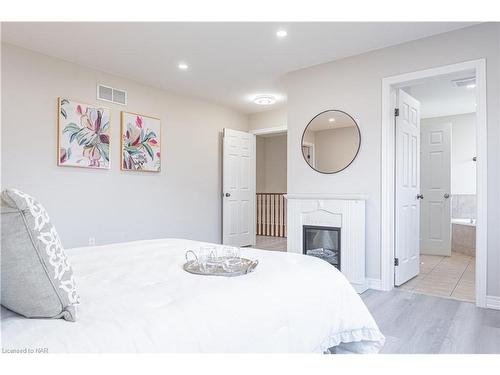 7045 Kalar Road, Niagara Falls, ON - Indoor Photo Showing Bedroom With Fireplace