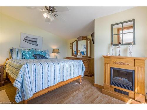 47 Gull Line, Lowbanks, ON - Indoor Photo Showing Bedroom With Fireplace