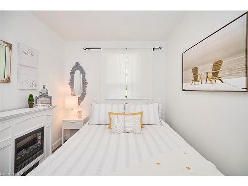 3913 Alexandra Road, Crystal Beach, ON - Indoor Photo Showing Bedroom With Fireplace