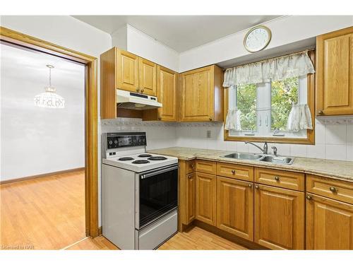 23 Overholt Street, St. Catharines, ON - Indoor Photo Showing Kitchen With Double Sink