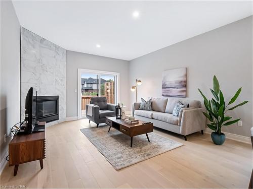 27 Austin Drive, Welland, ON - Indoor Photo Showing Living Room With Fireplace